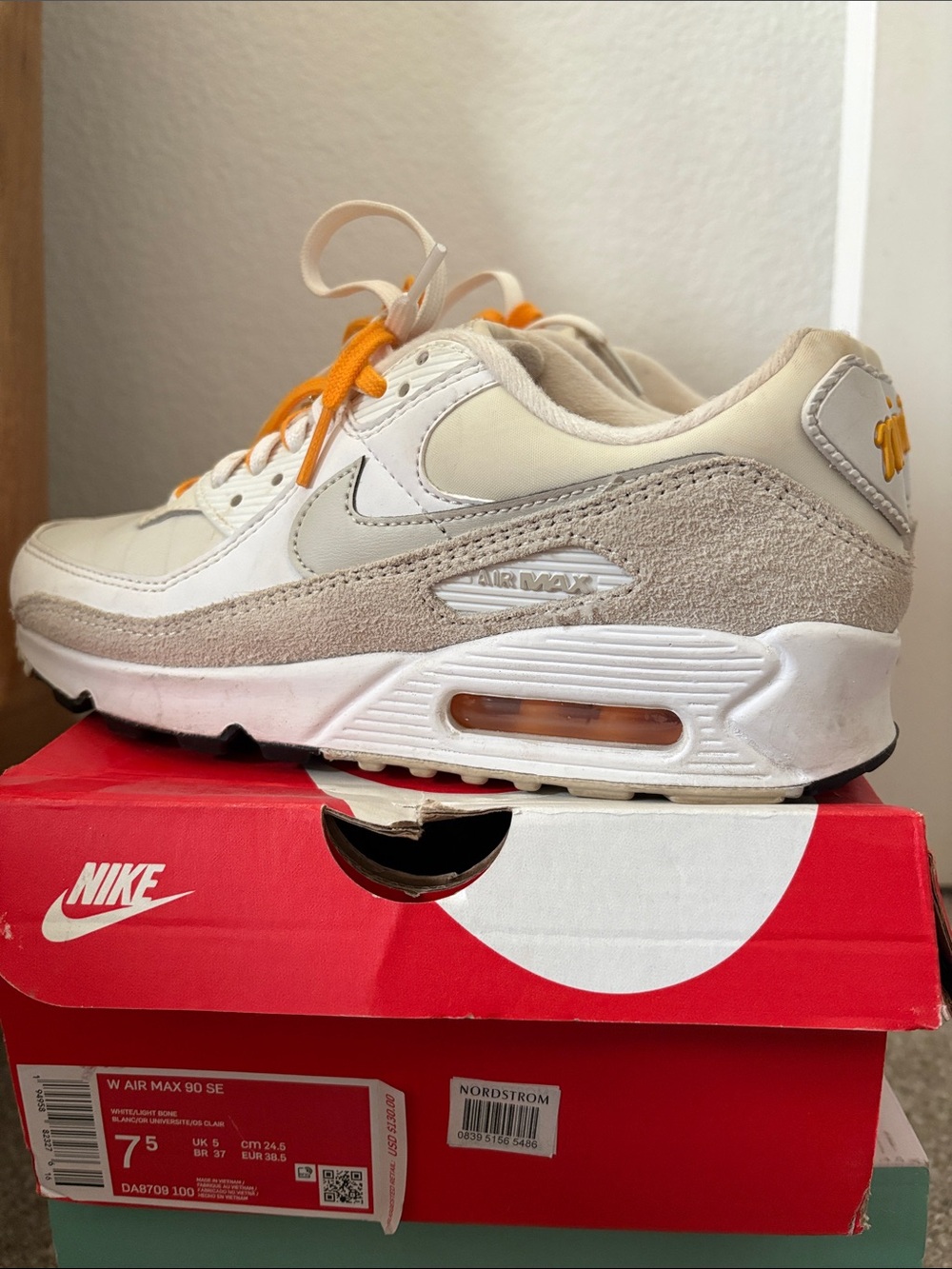 Nike Women’s Air Max 90 Sneakers in Cream with Orange Laces